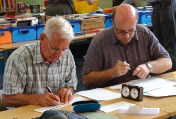 Brian Turner & Andrew Farthing prepare winners' cheques