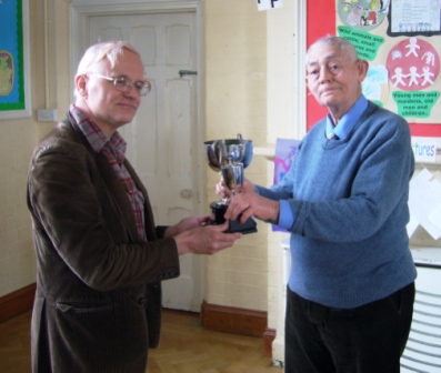 President Peter Kitson presents Tony West the Wheatly Cup for the Hagley team.