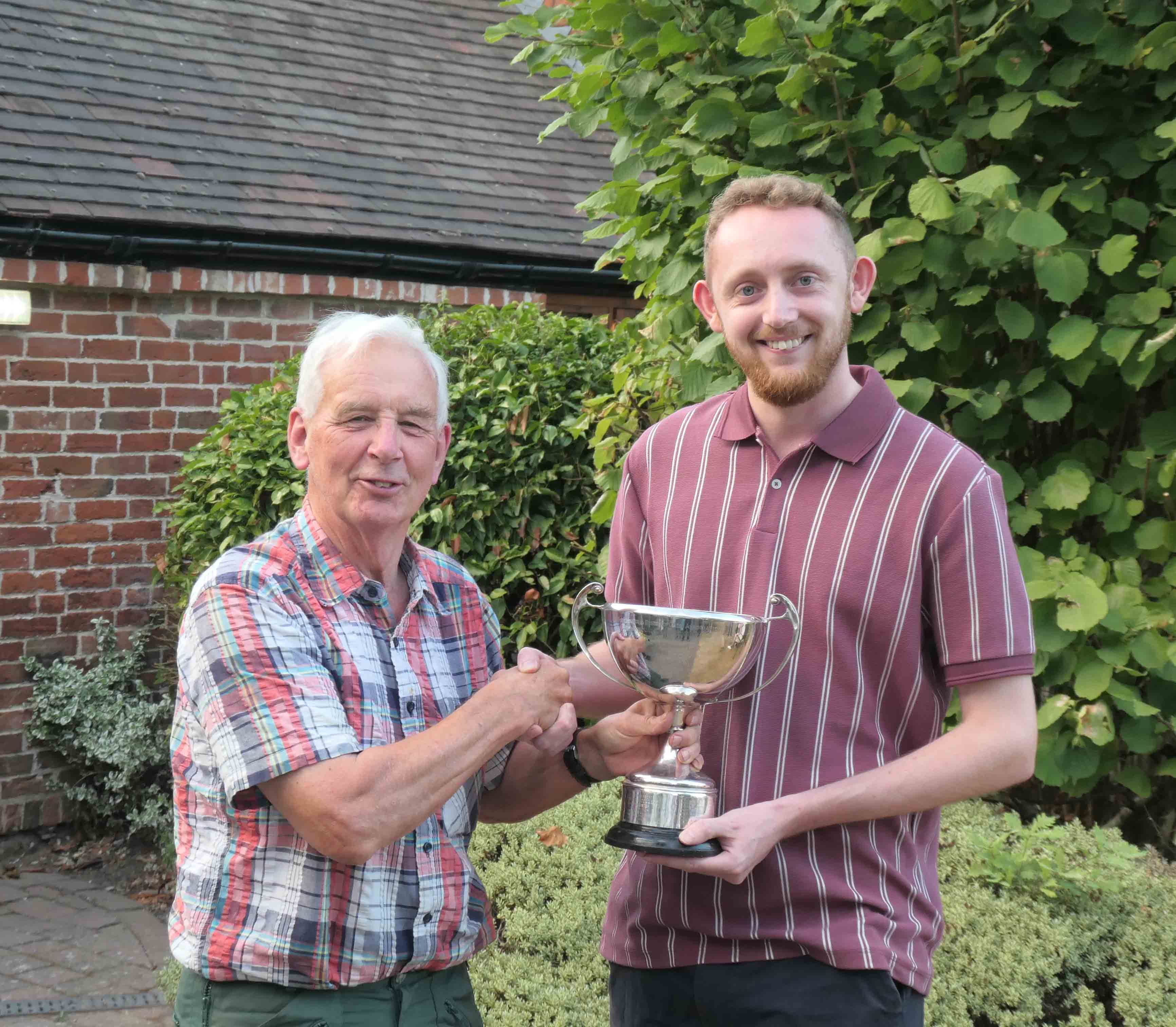 Competition controller presents Bennett Cup to winner